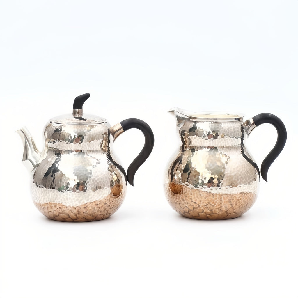 Pure 999 Fine Silver Hand-Hammered Silver Teapot and Creamer Set with Sleek Black Handles and Warm Metallic Accents - Handicraft