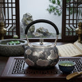 925 Sterling Silver Artisan Crafted Silver Teapot Featuring Embossed Lotus Pond Motif and Black Cord Handle - Handicraft